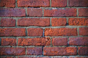 Traditional red brick wall, displaying a weathered and textured surface 4