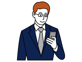 スマホを見るスーツの男性