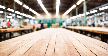 Blurred image of the busy environment of a factory with workers.