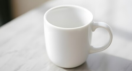 Fototapeta premium Glossy White Mug Placed on a White Table, Ready for Logo or Artwork Display