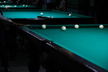 Sports game of billiards on a green cloth