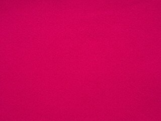 An expanse of deep fuchsia felt beckons with its luxuriously soft and textured presence