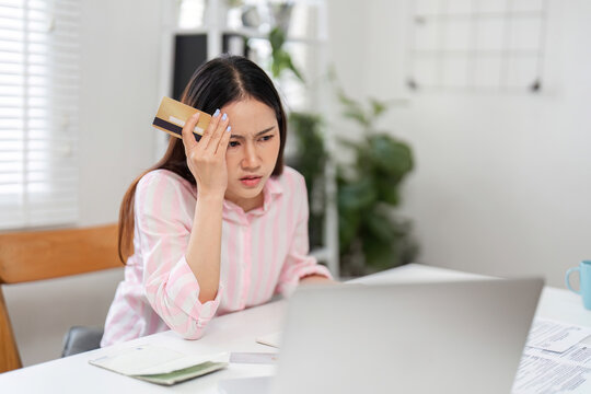 Budgeting and Online Shopping Confusion. A woman feels perplexed while checking her credit card bills.