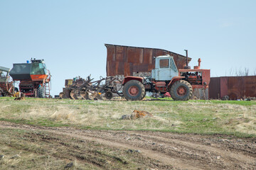Fototapeta premium Old abandoned agricultural equipments in the outdoors.