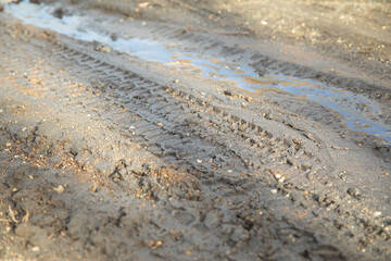  Dirty and muddy ground road in the nature at spring time.