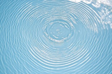 Top-Down View of Rippled Blue Swimming Pool with Circular Pattern