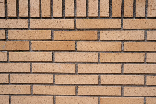 Background wall of yellow bricks closeup. - Powered by Adobe