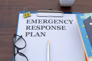 A response plan paper in a clipboard, emphasizing organized workplace emergency preparedness strategies.