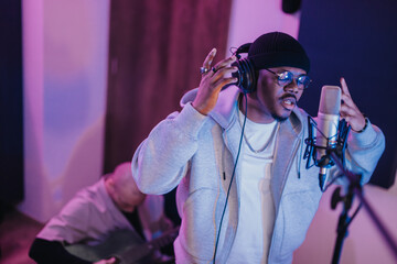 Two musicians immersed in a creative session, capturing the essence of music in a recording studio....