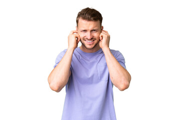 Fototapeta premium Young handsome caucasian man over isolated chroma key background frustrated and covering ears