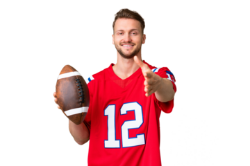 Young caucasian man playing rugby over isolated chroma key background shaking hands for closing a good deal