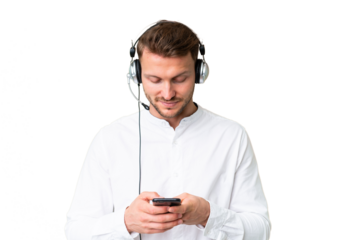 Telemarketer caucasian man working with a headset over isolated chroma key background sending a message with the mobile