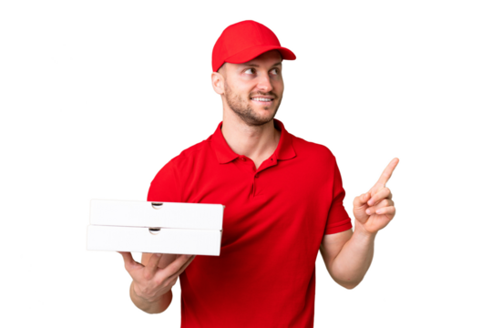 Pizza delivery man with work uniform picking up pizza boxes over isolated chroma key background pointing up a great idea