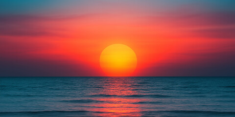 Obraz premium Vibrant sunset over calm ocean horizon with glowing sun and colorful sky gradient for travel, nature, peace or tropical beach themes