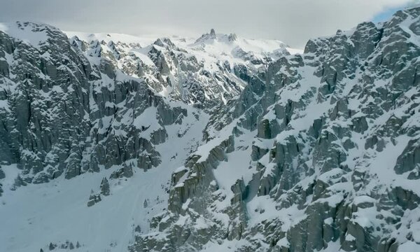 Aerial view Dombay's mountain territories. Mountain territories wilderness of high altitudes Mountain territories winter wonderland snow serenity Icy expanse spirit of wild is ever-present.