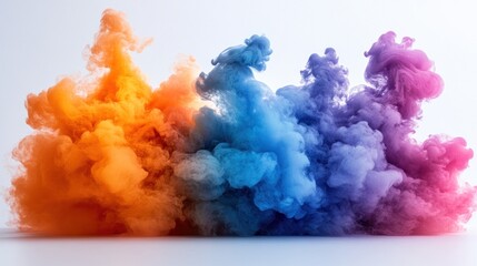 Colorful ink clouds swirling on white backdrop