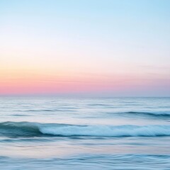 Gentle ocean waves under a colorful sky at twilight