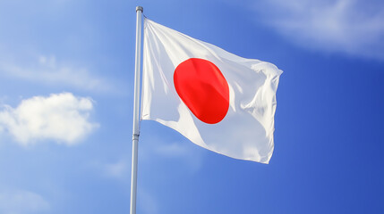 Waving Japan flag against a clear blue sky