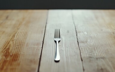 Silver Fork on Light Brown Wooden Table