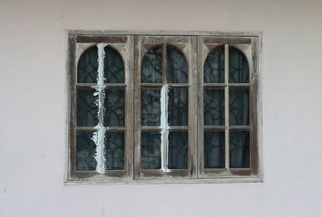 Old house window on the wall
