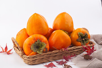 fresh ripe persimmon fruit on a wooden board