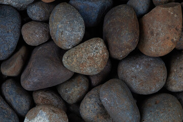 Close up Macro Shot Showcasing the Texture of Various Smooth Stones in Natural Earthy Tones