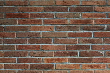 Close up Texture of a Rustic Brick Wall Showcasing Detailed Surface Patterns in Warm Earth Tones