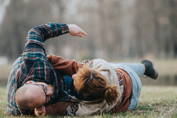 A couple engaging in playful and affectionate activities on a grassy area in a park, showcasing happiness, connection, and love, creating a beautiful bond in a tranquil outdoor setting.