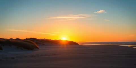 Obraz premium Low winter sun sets over Montrose dunes, viewed from St Cyrus beach at low tide, textures, light