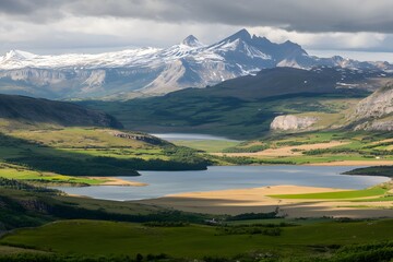 Fototapeta premium Mountain lake view, sunlight, green valley, peaks. Serene landscape