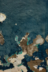 Cracked blue paint on aged wall