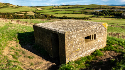 Fototapeta premium A World War 2 pillbox overlooking the south coast of England near Abbotsbury, Dorset, England