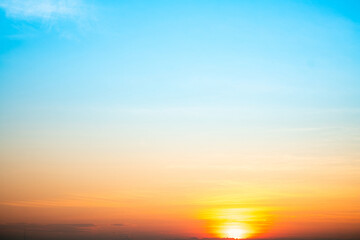 Sky,sunset, beautiful , luxury soft gradient orange gold clouds and sunlight on the blue sky perfect for the background, Sunrise on morning or evening in winter warm time ,Twilight summer,silhouette
