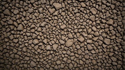 Dirt terrain forming a gravel stone road surface pattern