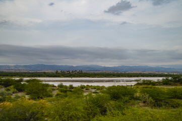 Turbat city landscape bridge clouds over the river