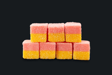 Multicolored jelly candies. Marmalade isolated on black. Sweets for everyone