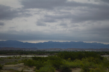 clouds over the river nature rainy season