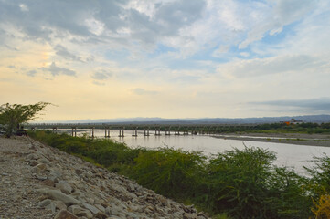 Obraz premium the river in the summer. Kech city Baluchistan bridge cloudy sky