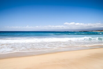 Fototapeta premium Sandy beach meets turquoise water under a bright blue sky