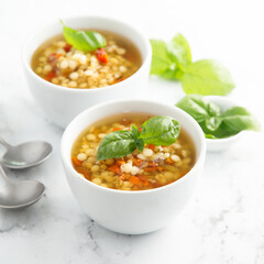 Vegan lentils soup with fresh basil