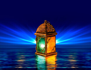 Glowing Ramadan lantern with intricate metal patterns reflecting on water, illuminated by warm and cool lights, against a deep blue radiant background. © Mohannad