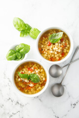 Vegan lentils soup with fresh basil