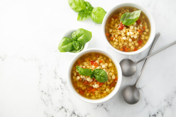 Vegan lentils soup with fresh basil