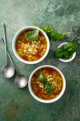 Vegan lentils soup with fresh basil