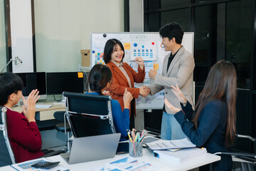 Obraz premium Young business team happy to be successful partnership teamwork success concept.