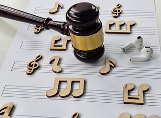 Musical notes and the court gavel. Theft of intellectual property and music and the court concept