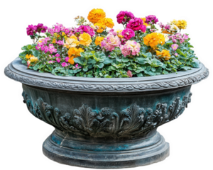 beautiful garden planter filled with vibrant flowers in various colors, showcasing mix of pink, yellow, and orange blooms. ornate design of planter adds elegance to floral display