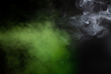 Green and white steam on a black background.