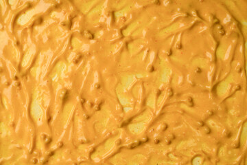 Yellow sauce splashes as a background.
