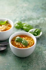 Vegan lentils soup with fresh basil